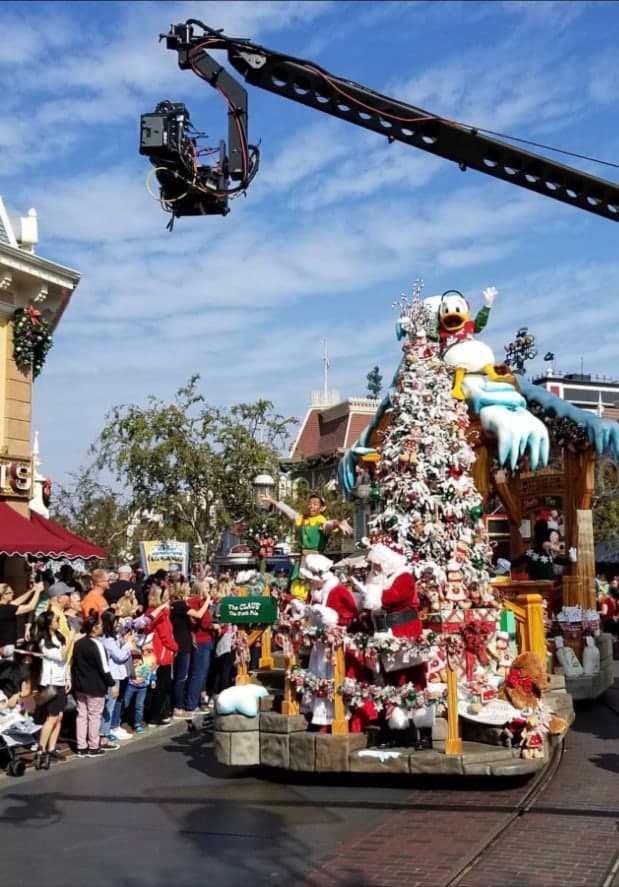 Camera crane operating above the ABC Disney Christmas Parade route