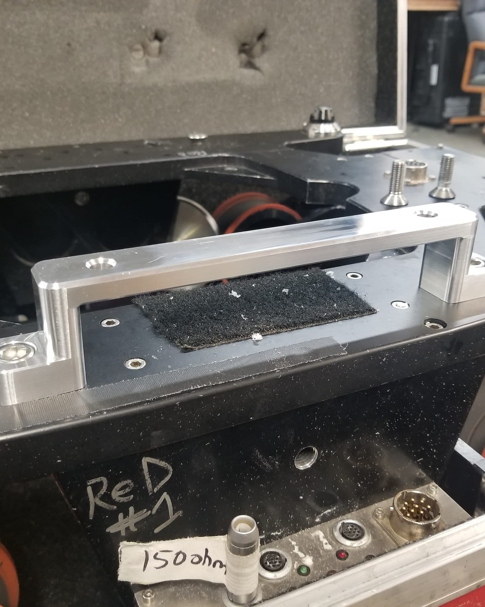 Custom-machined aluminium bracket fitted into a camera case in the Fluid Pictures shop