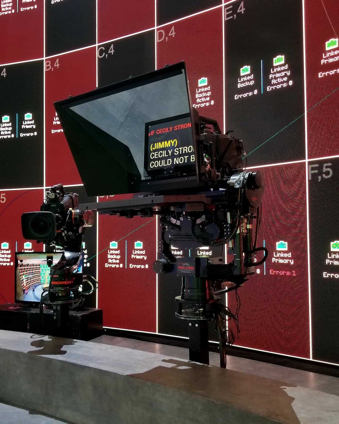 Custom prompter rig with camera on a stand in front of an LED volume wall