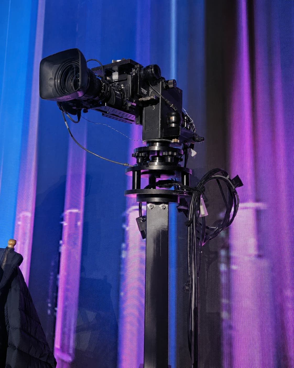 Fluid Pictures Stanton Mini non-stabilized remote head carrying a broadcast camera under blue stage lighting