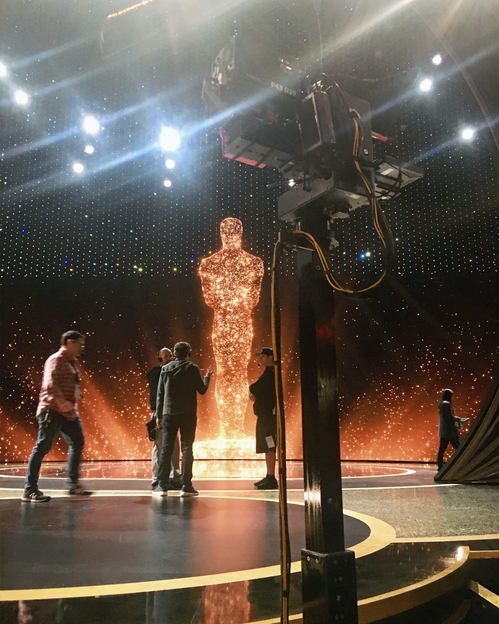 Talon remote head carrying a camera on the Academy Awards stage beside the illuminated Oscar statue during rehearsal