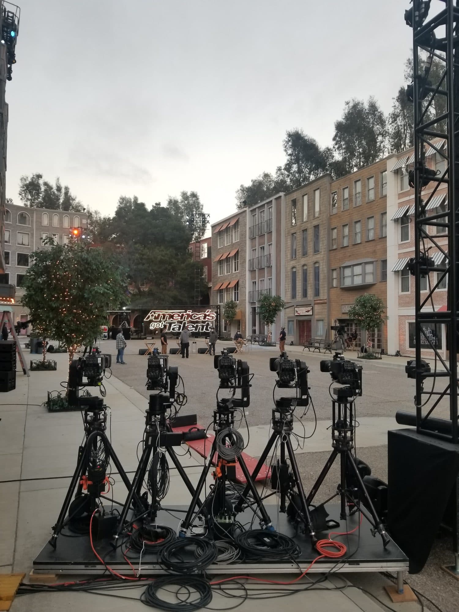 A row of remote heads on tripods on the America's Got Talent backlot set
