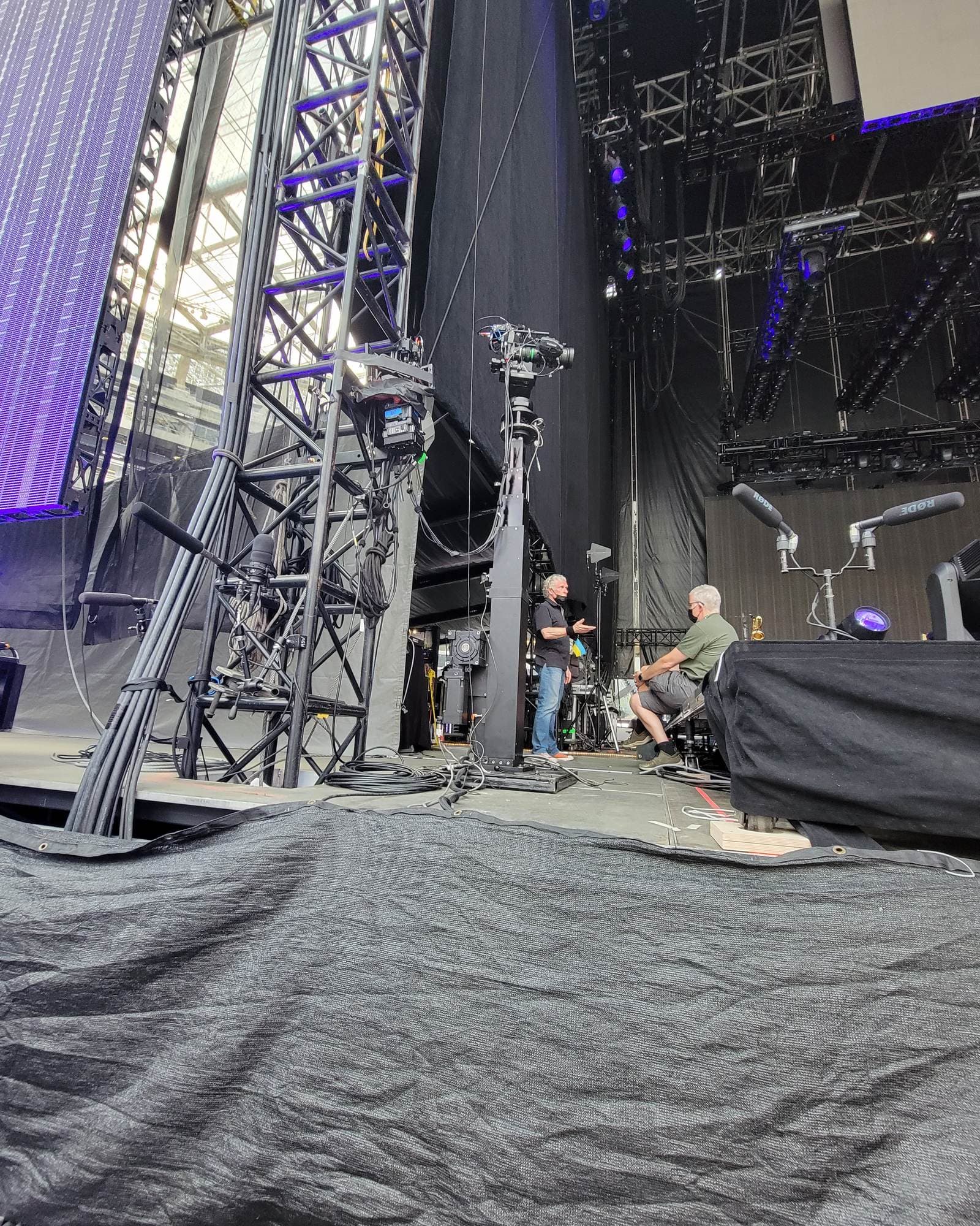 MAT Towercam 410 being set up on a stage below the lighting truss