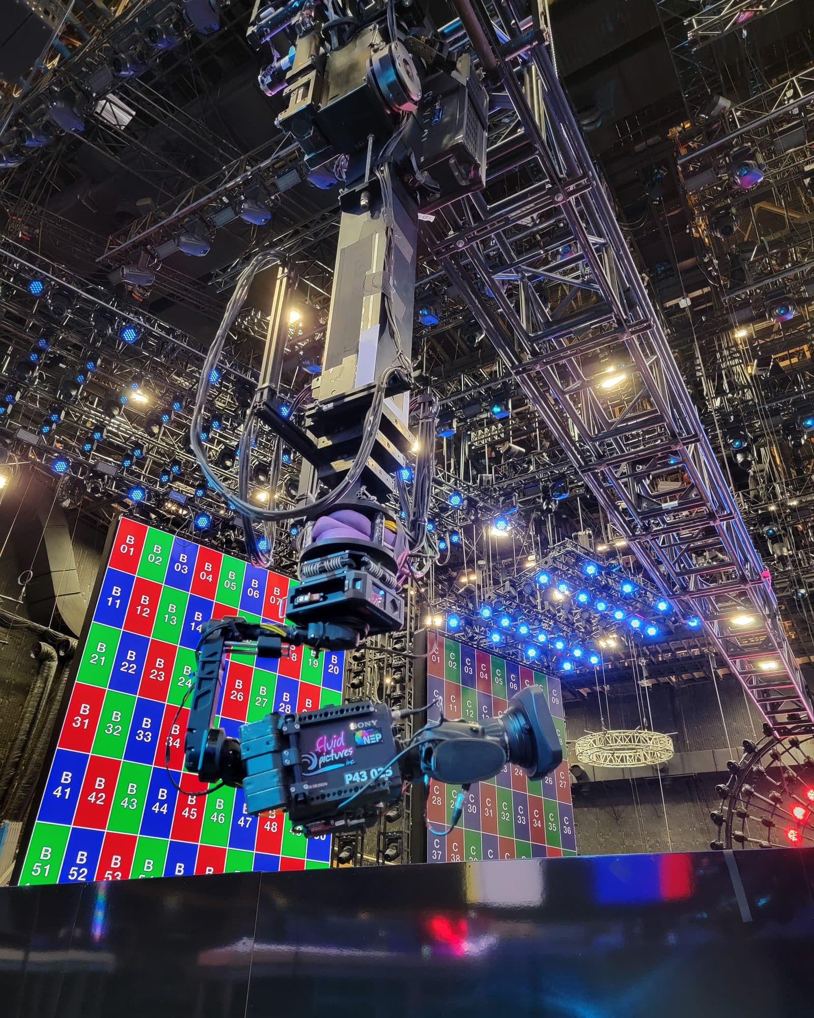 MAT Twin Peek towercam extended to full height, carrying a camera above the stage and lighting