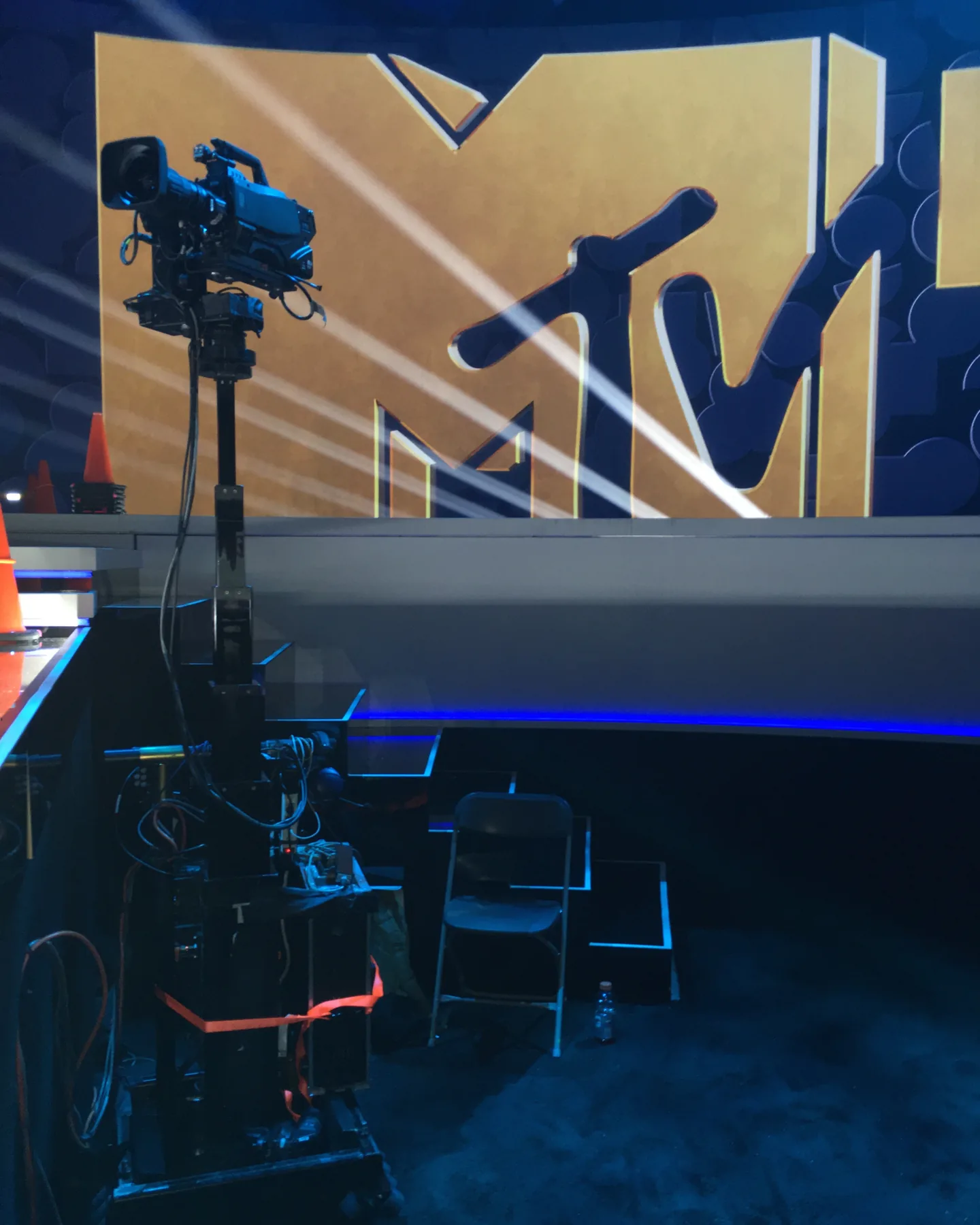 Towercam XS+ carrying a broadcast camera in front of a giant MTV logo lit with beams