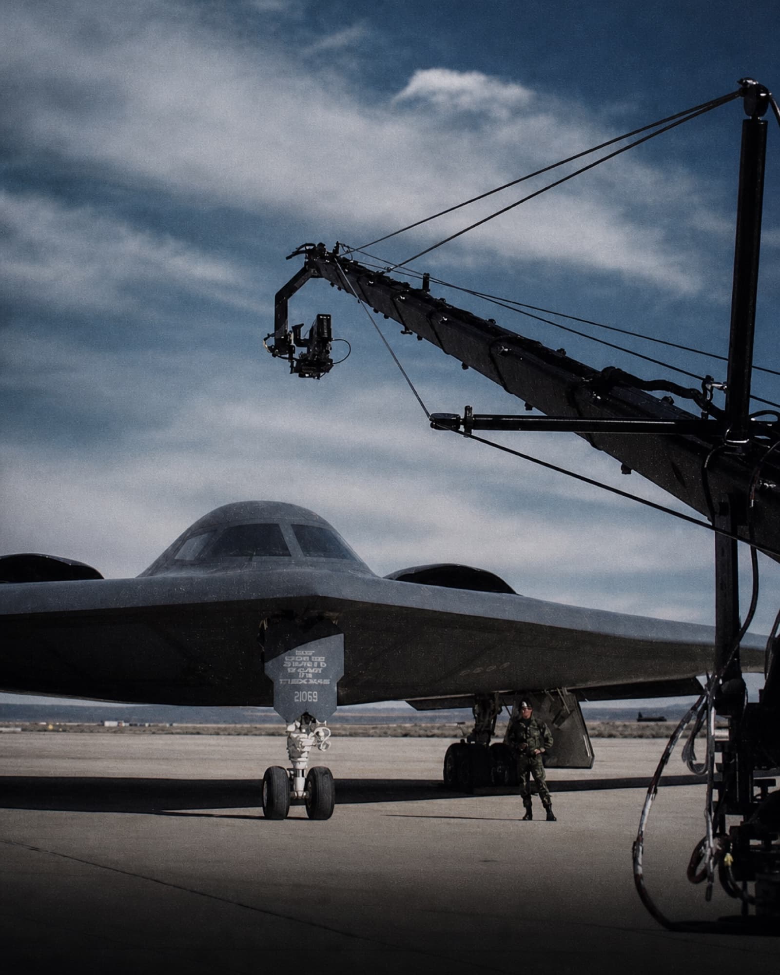 Fluid Pictures camera crane carrying a remote camera beside a B-2 aircraft