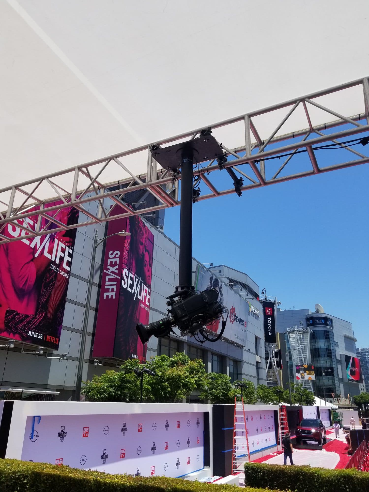 Stanton Mini remote head hung from truss over an outdoor red carpet