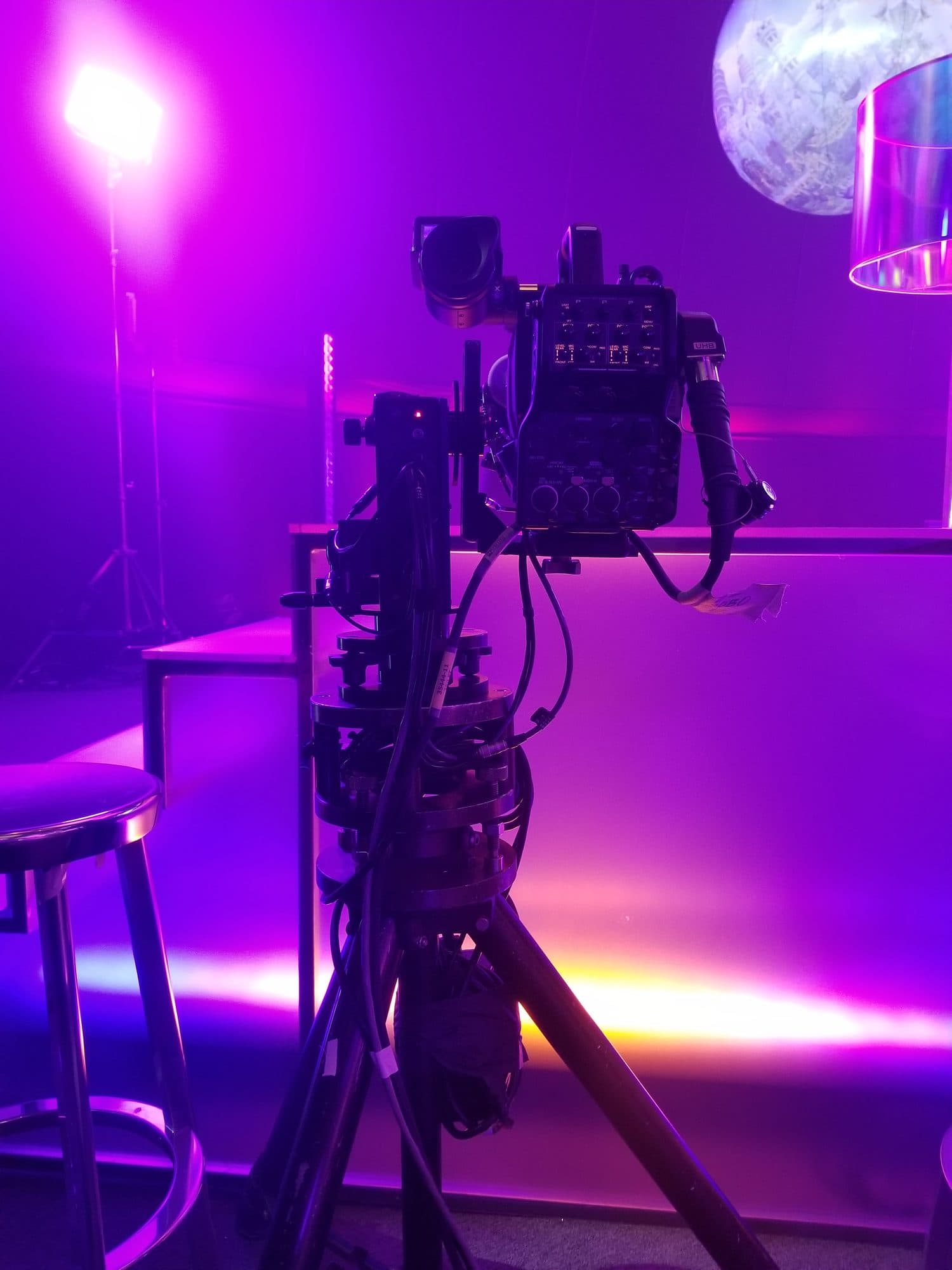 Stanton Mini remote head on a tripod on a purple-lit YouTube Pride 2021 set