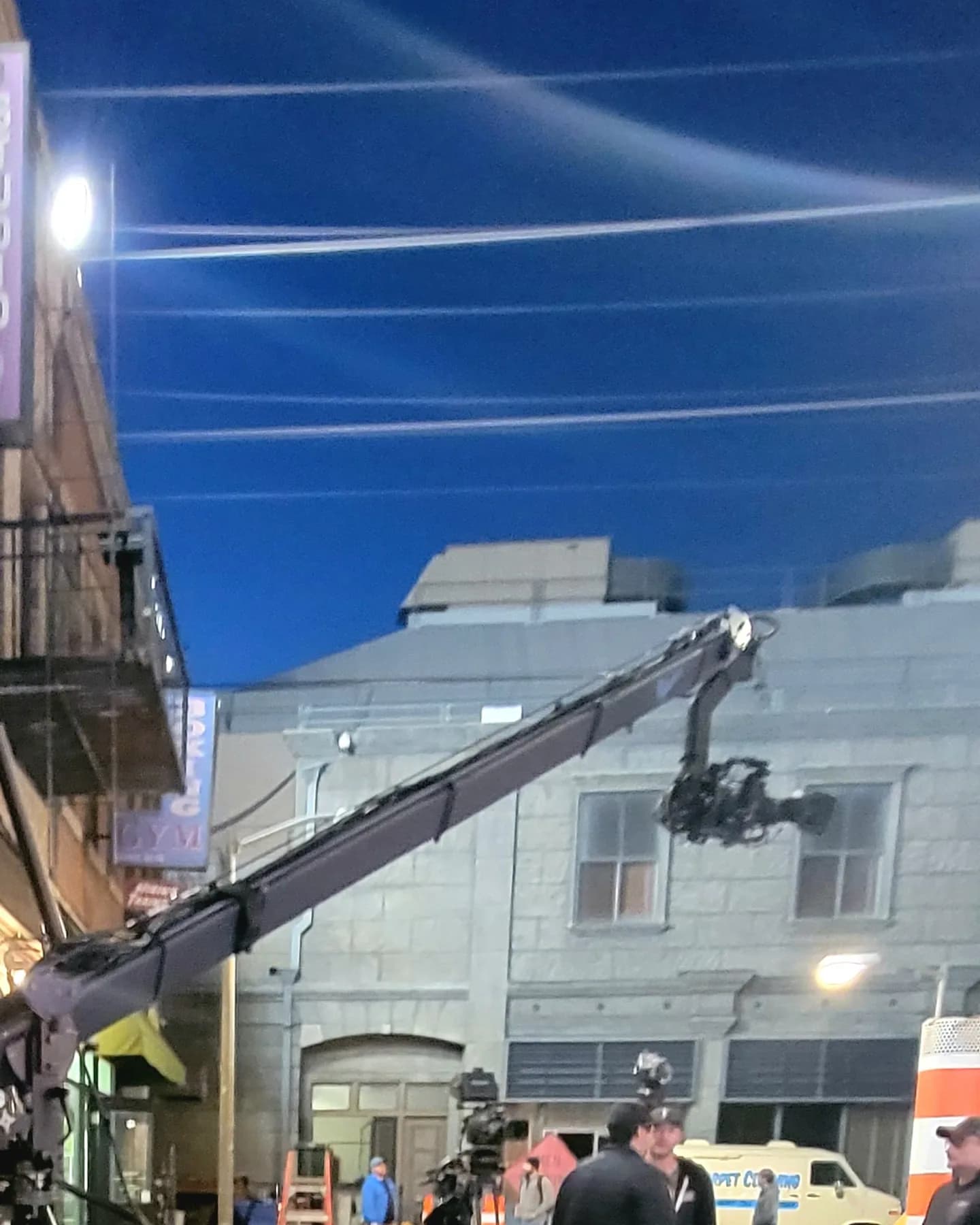 Stanton Triangle remote head with camera on the end of a jib arm over a backlot street
